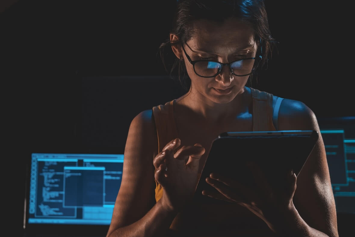 An image showing a woman using biometrics on a device.