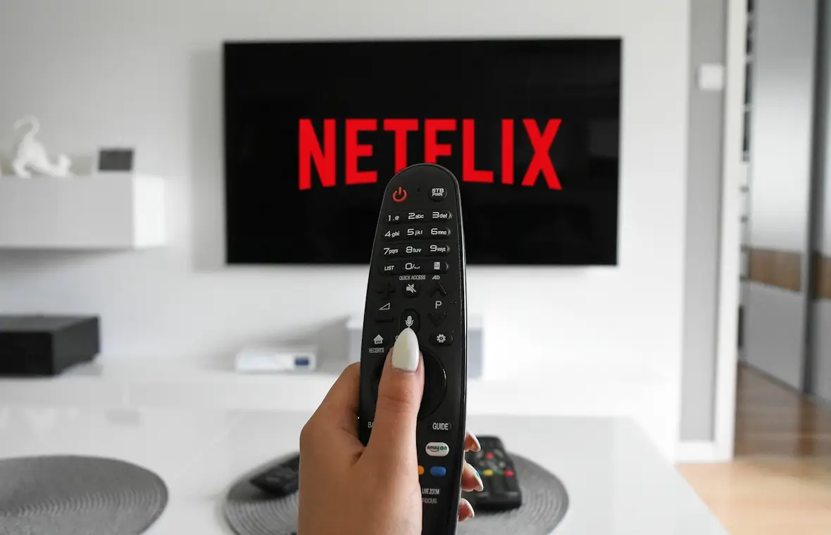 An image of a Netflix screen and a remote control.