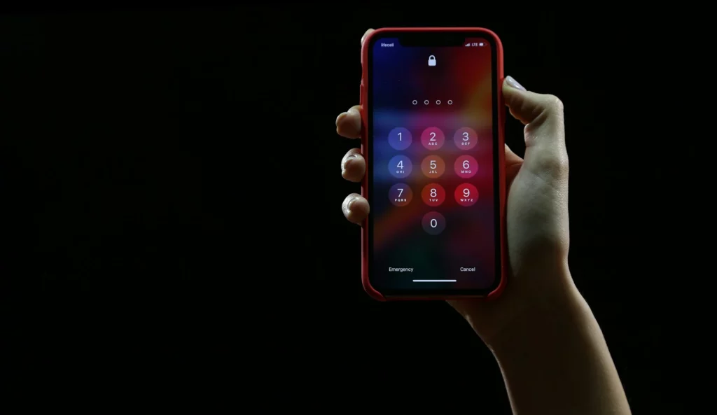 iPhone password lock screen with dark background