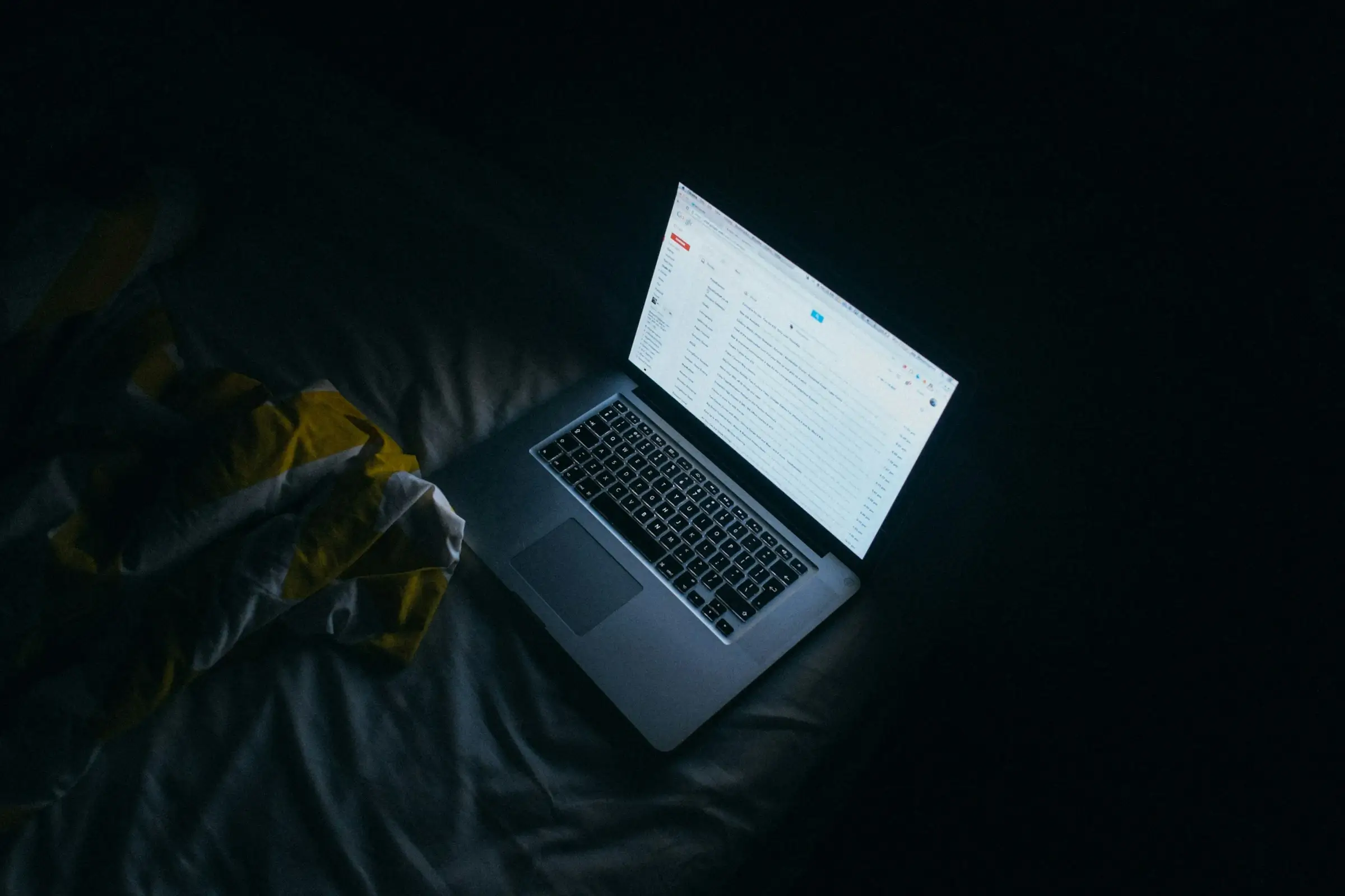 An image of a person surfing the internet in the night.