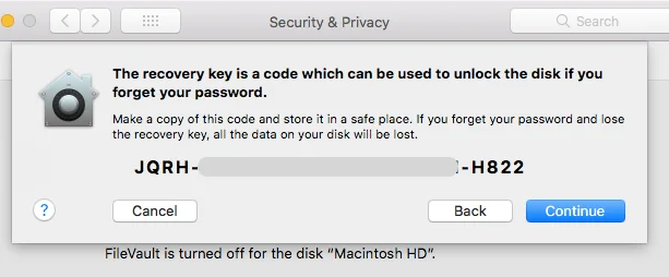 A screenshot showing the FileVault recovery key being displayed, with digits blurred out. 