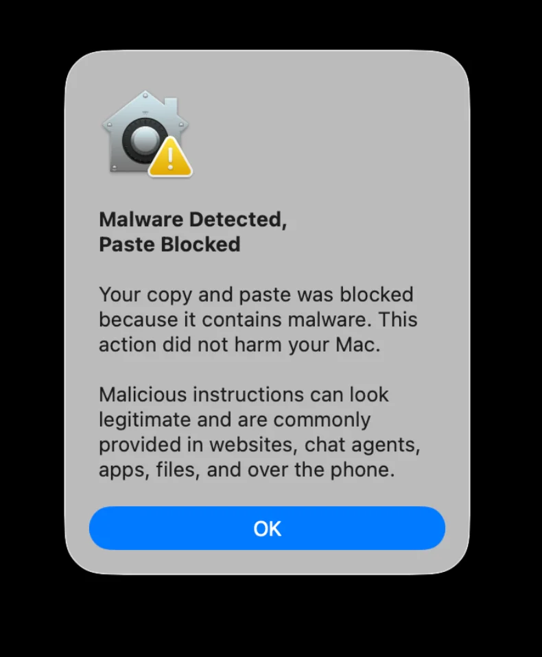 A screenshot of a Mac security alert indicating "Malware Detected, Paste Blocked."
